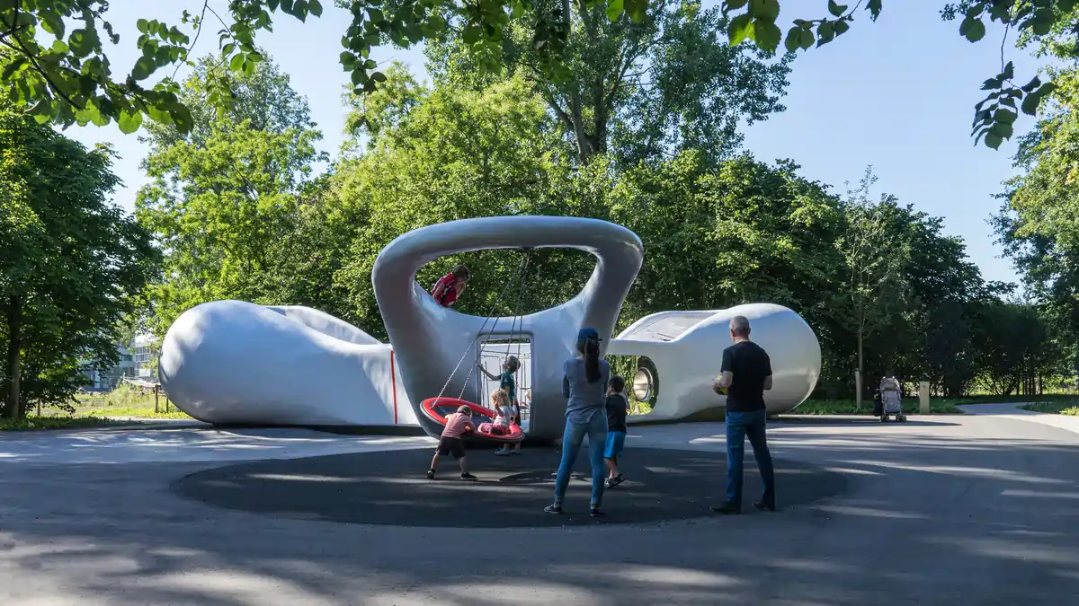 Spring magnolias blooming beside a pond in Beatrixpark near the RAI Centre, Amsterdam.