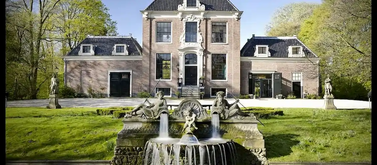 Baroque gardens and the historic Huize Frankendael mansion in east Amsterdam on a sunny day.